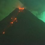 Spectacular images of the meteor exploding above an erupting volcano in the Philippines